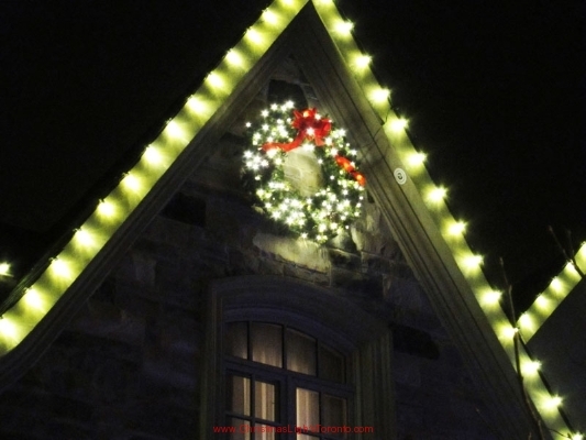 Christmas wreath secured on high peak by LawnSavers Christmas Decorators